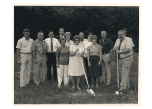 1985 Board of Trustees posing with shovels on the land that will be the Library's