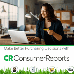 Woman smiling happily with credit card in hand looking at laptop